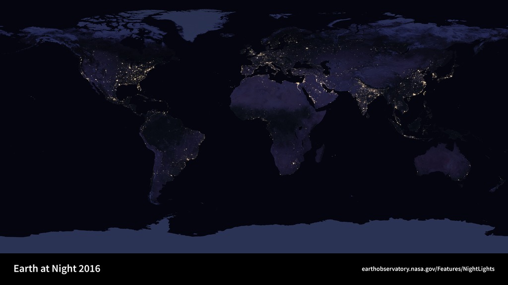 NASA Black Marble image of Earth at night with city lights visible across continents.