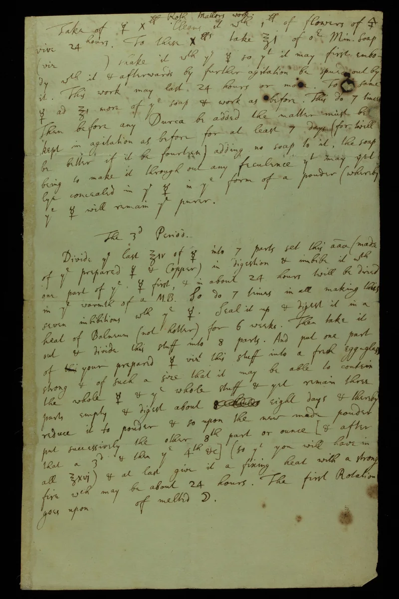 A page of alchemical notes in Isaac Newton’s handwriting, with symbols and densely written recipes.